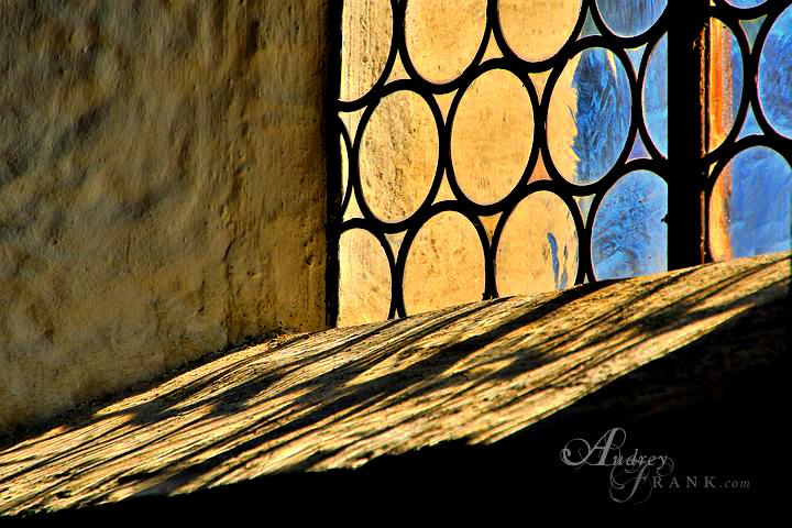 a church window with golden sunlight flooding through
