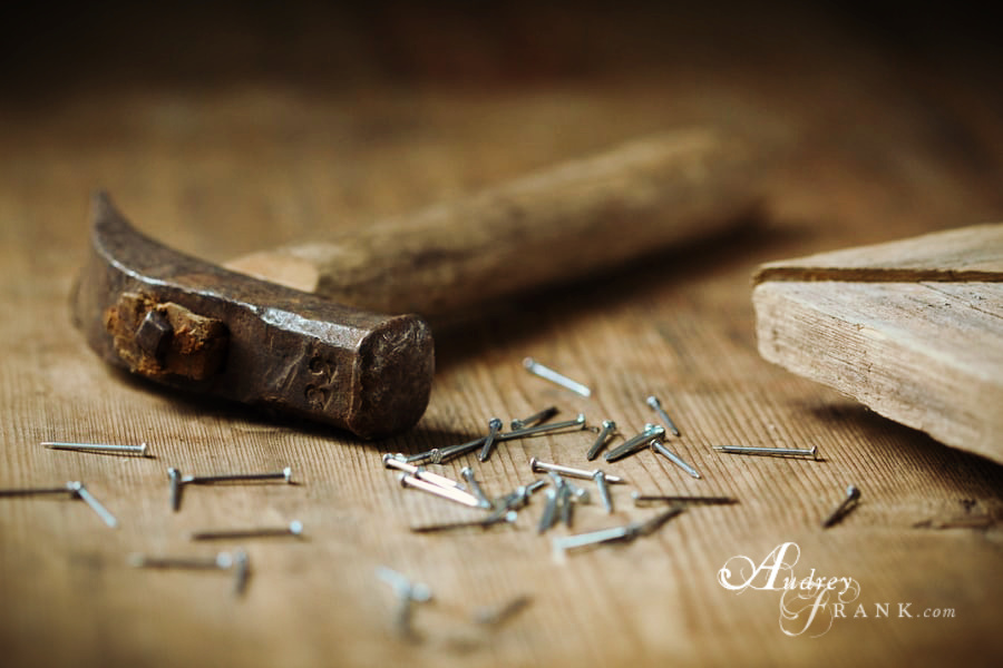 A picture of a hammer and nails, inviting the viewer to begin the work.
