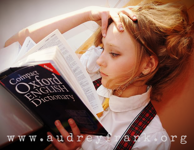 A girl reading the Oxford English Dictionary