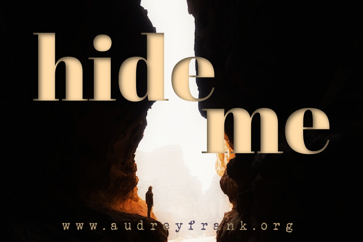 a person standing in the cleft of a rock with the words "hide me" describing the post.