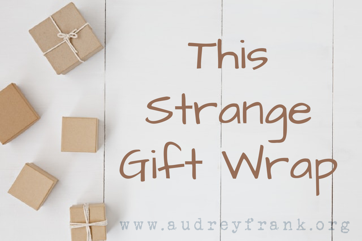 Small gifts scattered with the words This Strange Gift Wrap