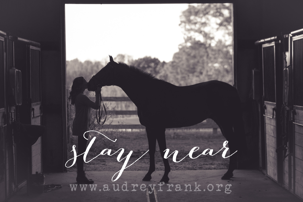 A silhouette of a woman and a horse and the words Stay Near describing the subject of the post.