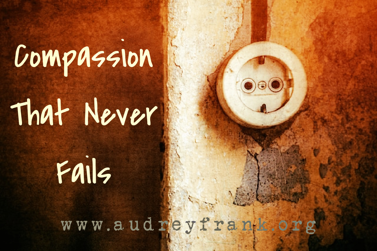 An old electric socket with the words "compassion that never fails" describing the subject of the post.