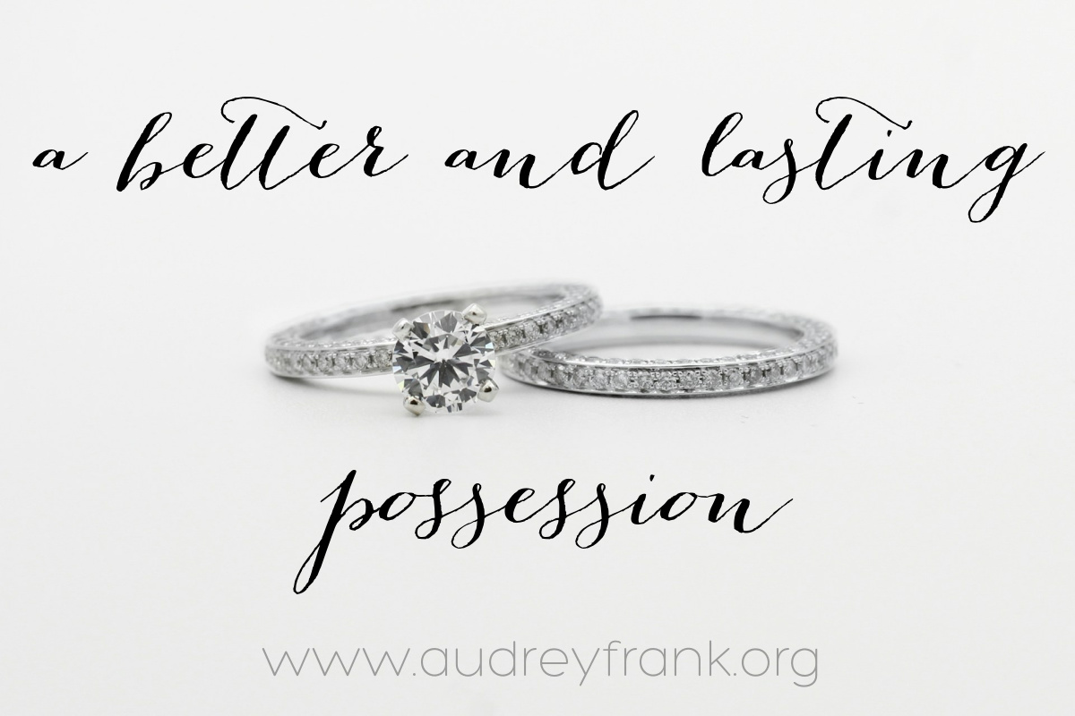 wedding rings and the words "a better and lasting possession"